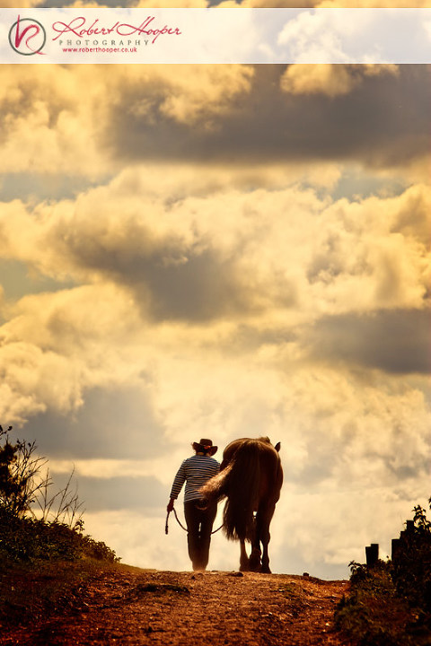 Horse and rider with dramatic cloudscape 0509-ls-0058