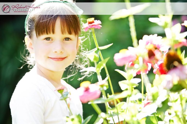 Bridesmaid Nadia checks Sarah's Mum's beautiful garden 0909-SDJH-0028