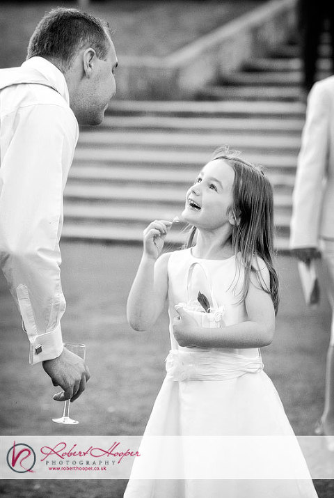 Natural moments - bridesmaid with buttercup - 0909-JHJA-986