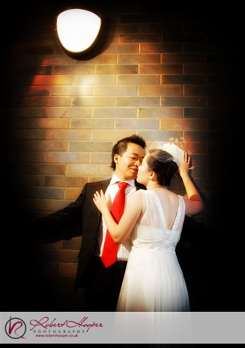 A subway entrance provides a romantic backdrop for our engaged couple 