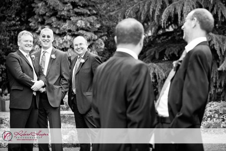 Laughing groomsmen - informal wedding photography 