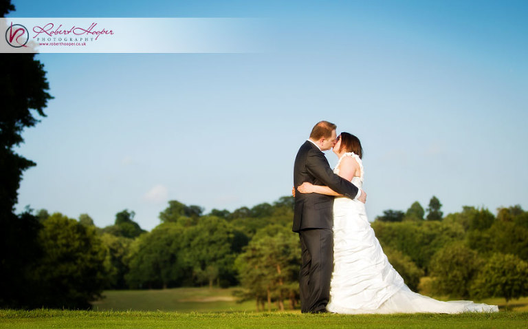 Bride and groom on golf course 