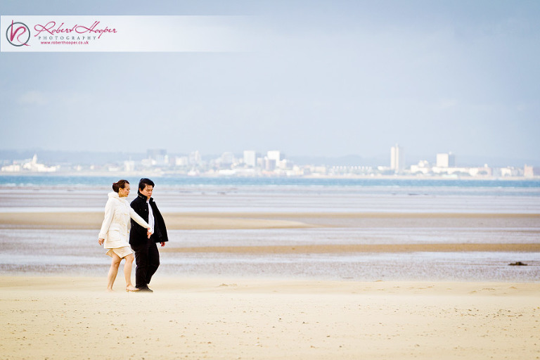 Romantic couple walk on the beach 