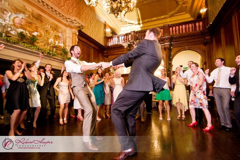 Two grooms on the dance floor at Addington Palace 