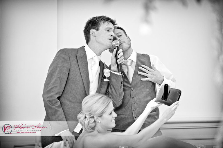 Singing groom at wedding reception 