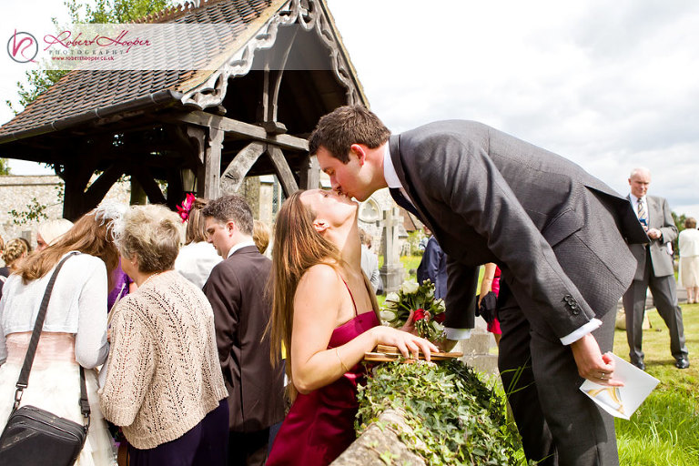 Bridesmaid kiss - documentary wedding photography 