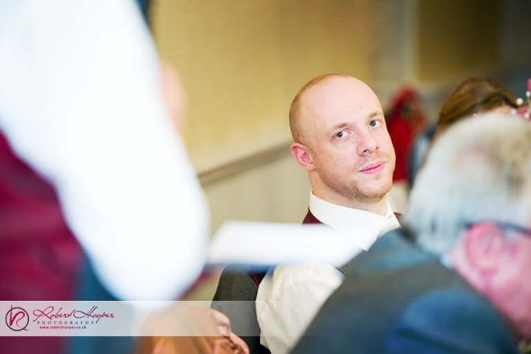Emotional groom during best man speech 