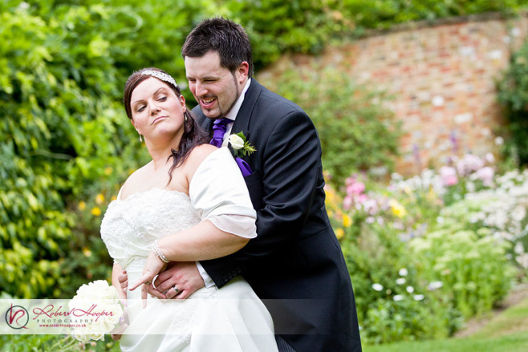 Bride and groom having fun at Langshott Manor 