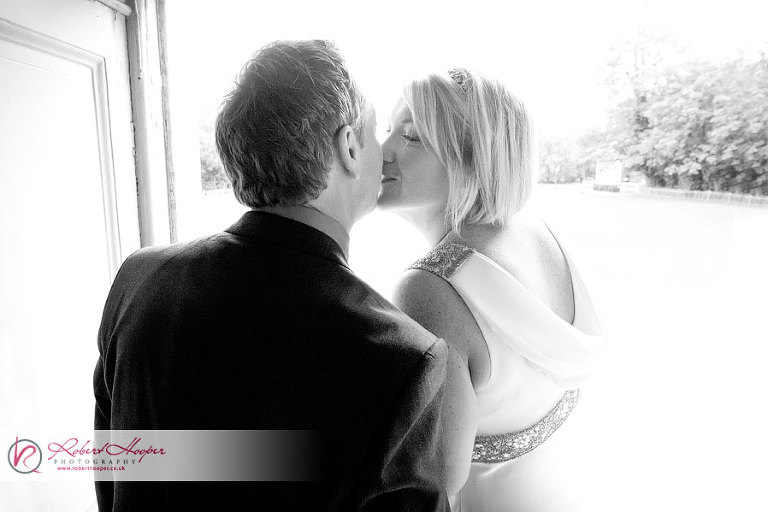 Bride and groom kissing at Marble Hill House 