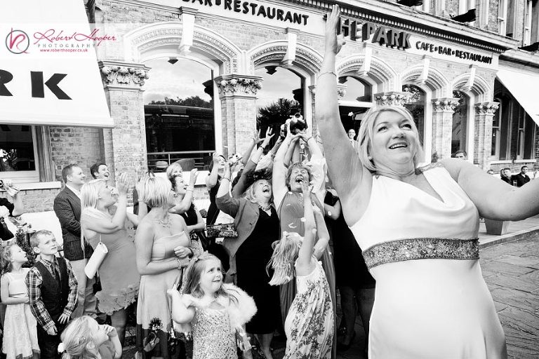 Bride tosses bouquet off routemaster bus 