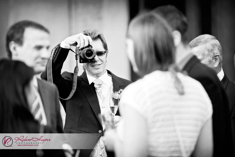 Guest photographer at wedding 