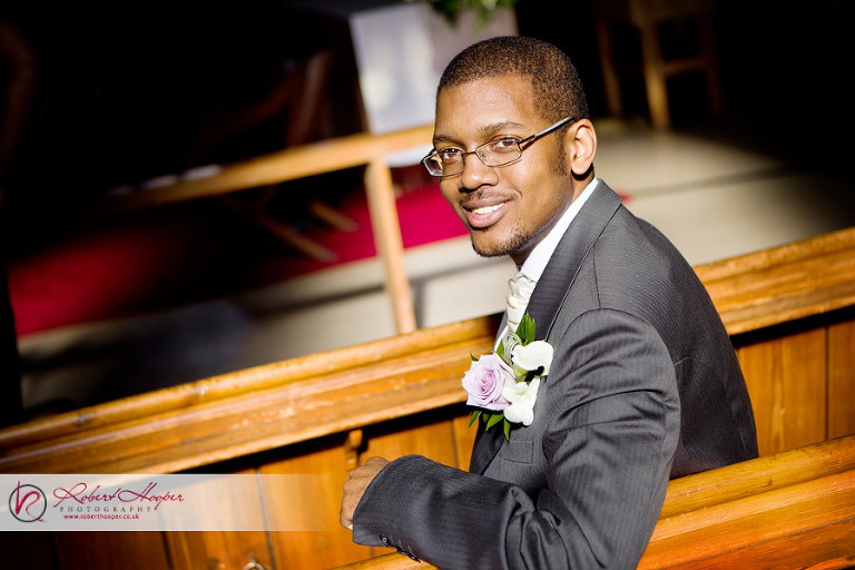 Groom portrait in church 