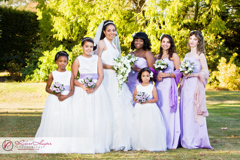 Bride and bridesmaids in traditional wedding pose 