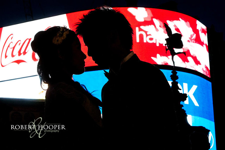 Night time pre-wedding photography at Piccadillly London with Eros silhouette