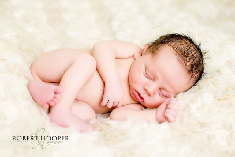 Cute snuggly sleeping newborn baby