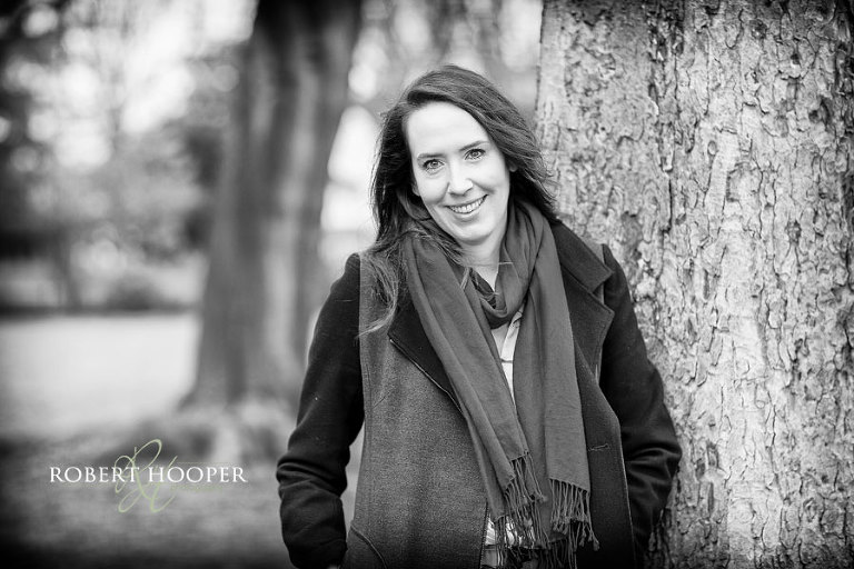 Natural headshots in South Croydon. Simple black and white female headshot outside in a local park.