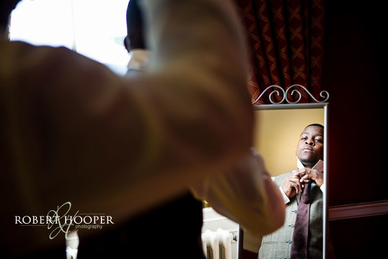 Groomsmen prepare for Addington Palace wedding