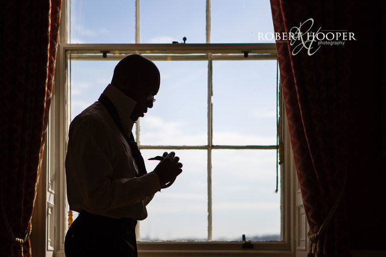 Groomsmen prepare for Addington Palace wedding