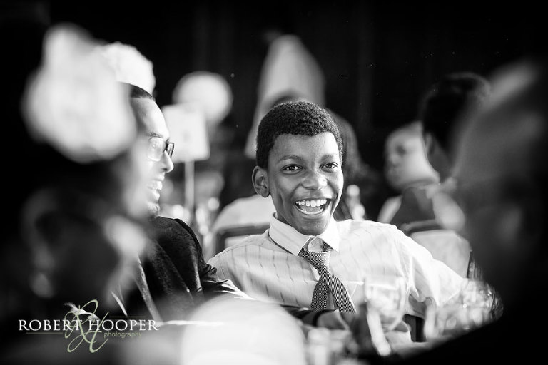 Addington Palace wedding reception - guests laughing at wedding speeches from best man and groom after wedding breakfast in the great hall