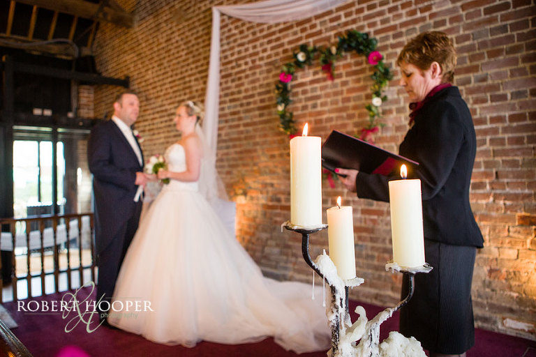Wedding ceremony at Cooling Castle Barn Kent