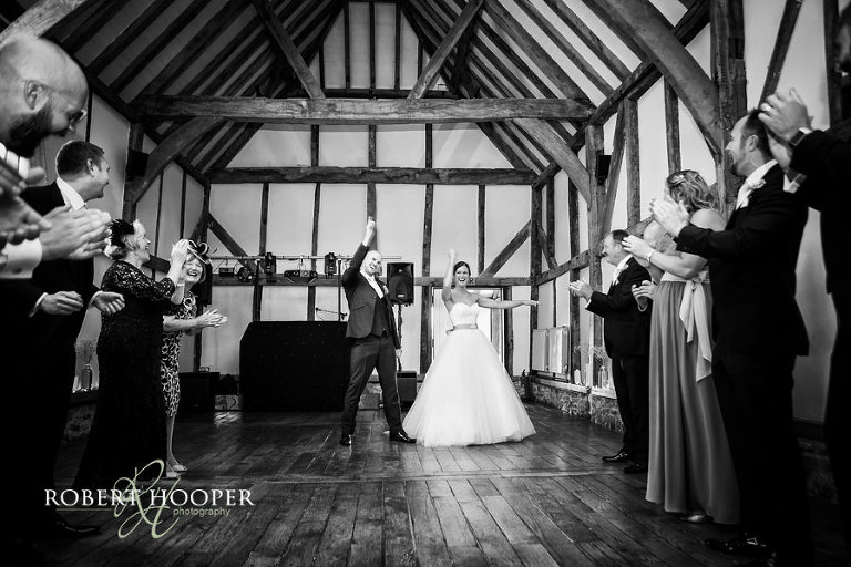 Dancing in to wedding breakfast at Tithe Barn, Loseley Park near Guildford in Surrey