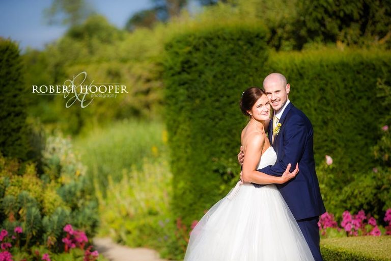 Surrey bride and bride groom in walled garden on their wedding day at Loseley Park near Guildford