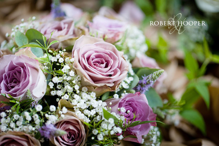 Beautiful bridal bouquet of pink roses and gyp for wedding at Cain Manor in Surrey
