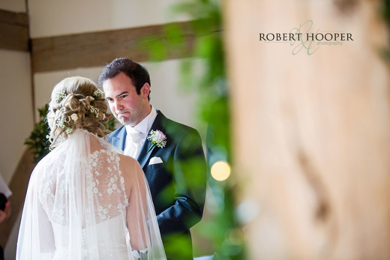 Groom during marriage ceremony at Cain Manor in Surrey