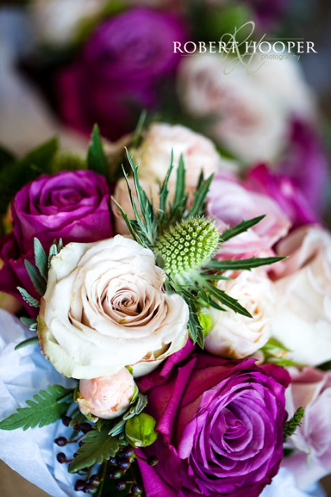 Stunning bridal bouquet of pink roses for Kent wedding at Cooling Castle Barn in Rochester