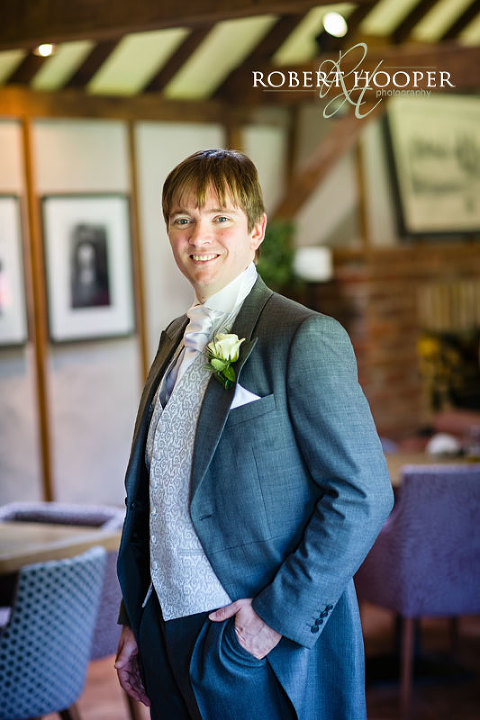 Portrait of groom in natural light before wedding ceremony at Cooling Castle Barn, Rochester in Kent