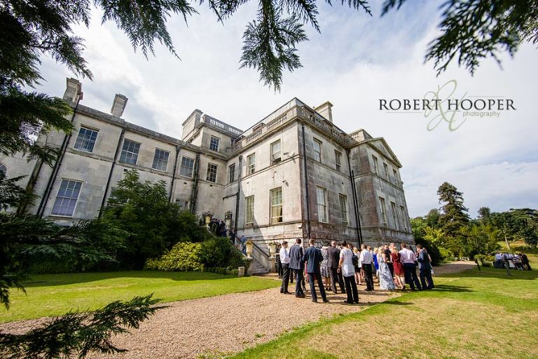 Guests at wedding drinks and canapes reception in the grounds of Addington Palace in Croydon, Surrey