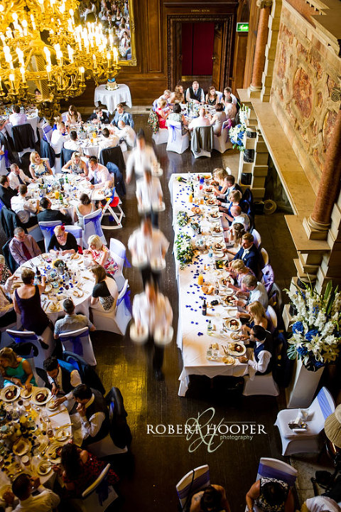 Waiters serving wedding breakfast in the Great Hall Addington Palace, Croydon in Surrey