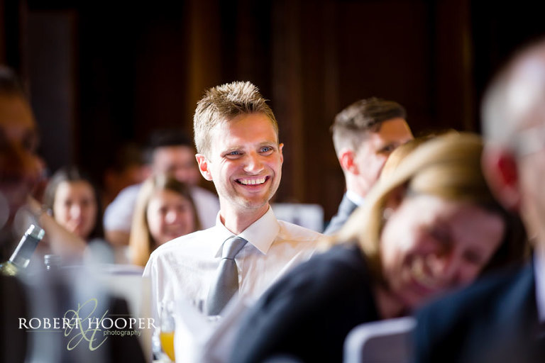 Wedding guests enjoying the wedding breakfast and speeches in the Great Hall at Addington Palace in Croydon, Surrey