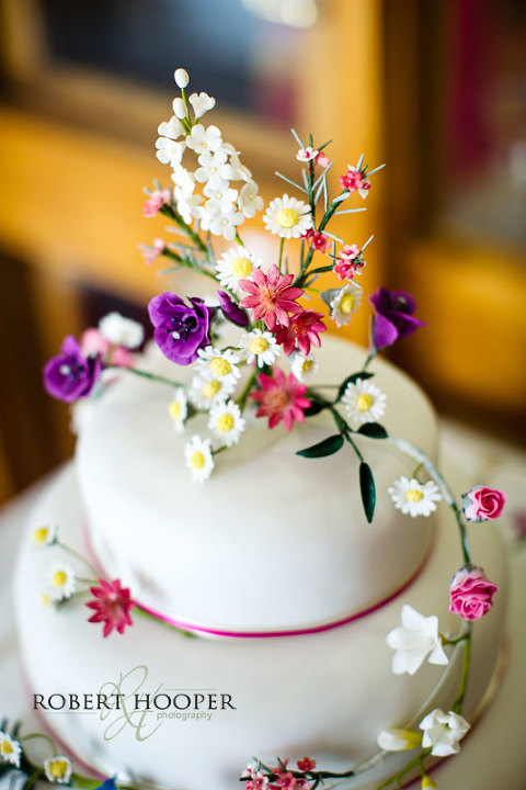 Pretty wedding cake at wedding breakfast Westerham Golf Club in Kent