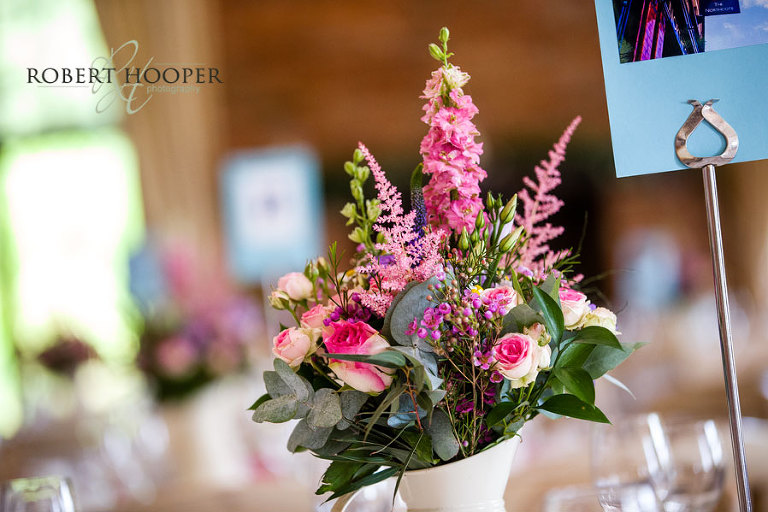 Table flower centre piece at wedding breakfast in Westerham Golf Club venue Kent