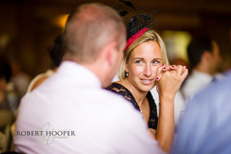 Natural shot of wedding guest during wedding breakfast at Westerham Golf Club venue in Kent