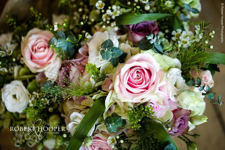 Bride's bouquet of pink and white roses for wedding at Bix Manor, Henley on Thames in Oxfordhsire