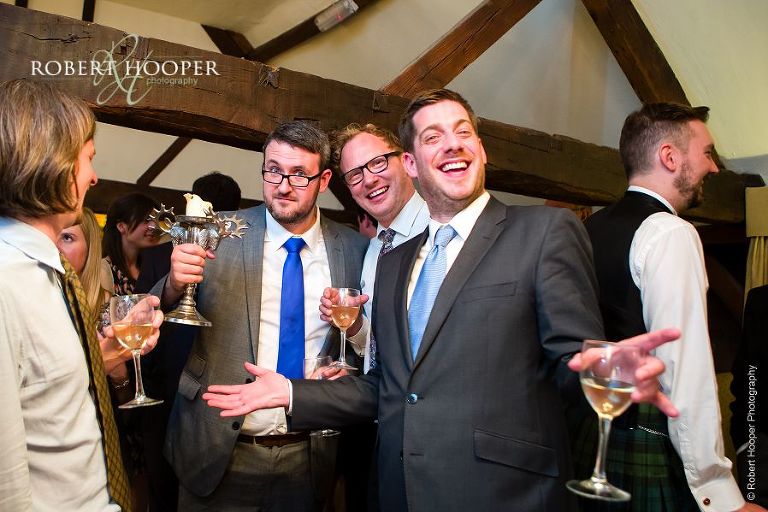 Guests enjoying wedding reception drinks at Bix Manor in Oxfordshire