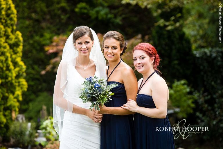 Bride and her bridesmaids in the garden on summer wedding day in Surrey