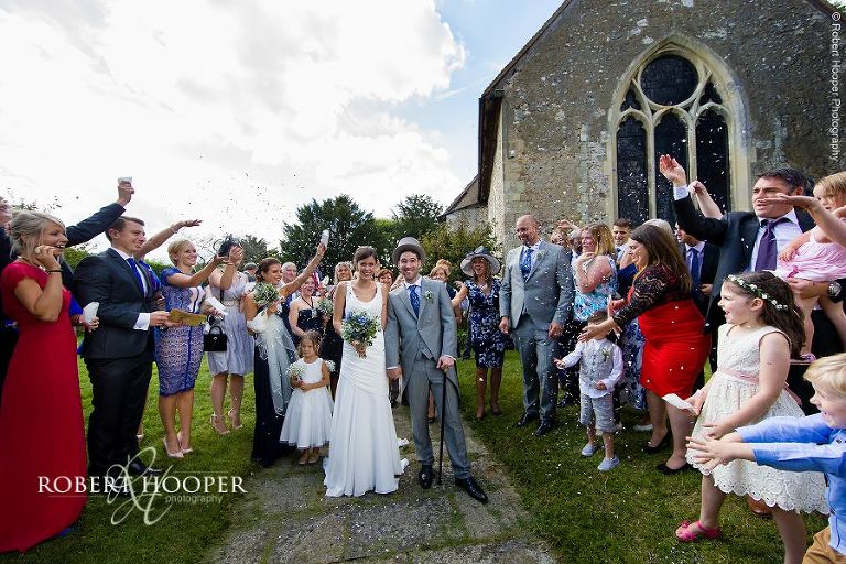 Confetti throwing after wedding service at Send Church in Surrey
