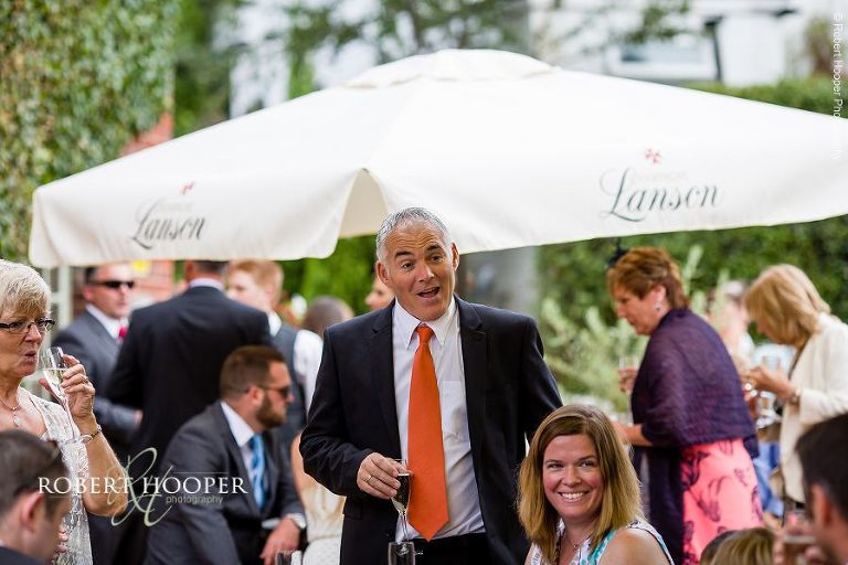 Guests on wedding day enjoying reception at The Stag on the River in Eashing, Surrey