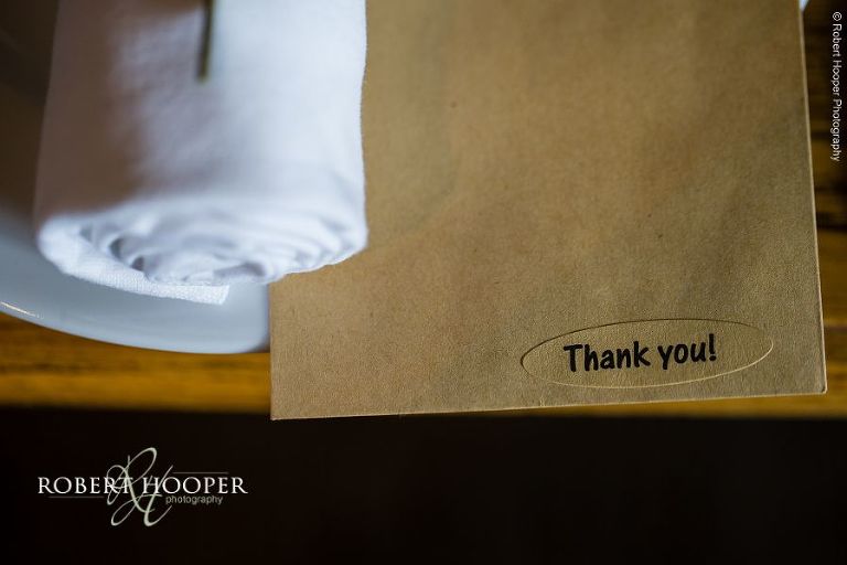 Table setting with thank you card on table at wedding reception in The Stag on the River, Eashing in Surrey