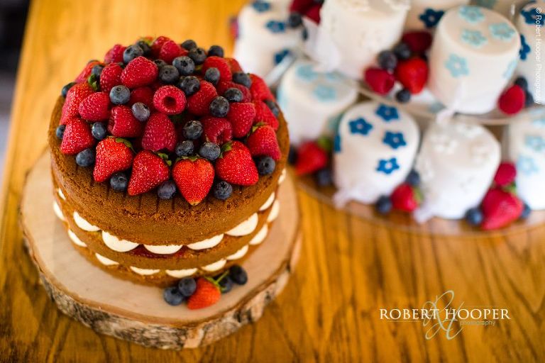 Sponge, blueberry and strawberry cream wedding cake at Stag on the River, Eashing in Surrey