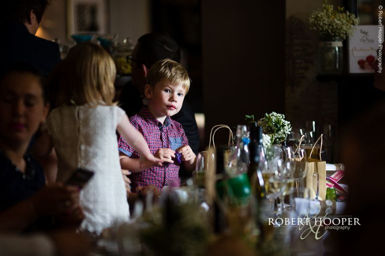 Young guest at wedding reception at The Stag on the River in Eashing, Surrey