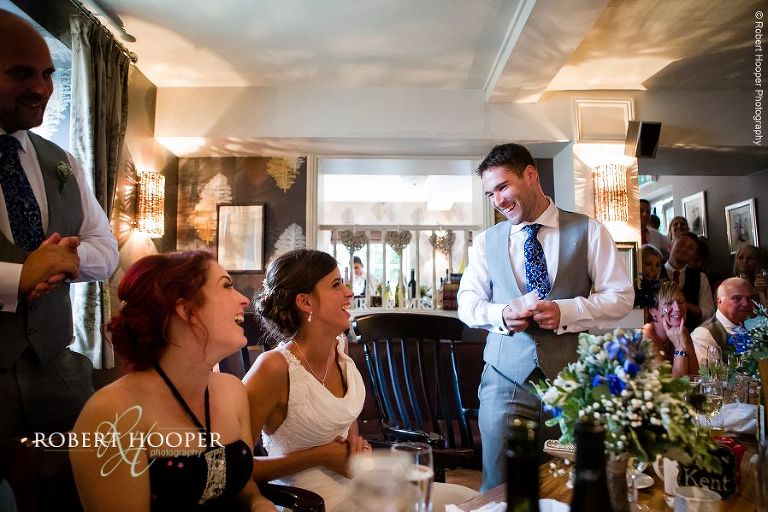 Groom giving his speech at wedding breakfast at The Stag on the River, Eashing in Surrey