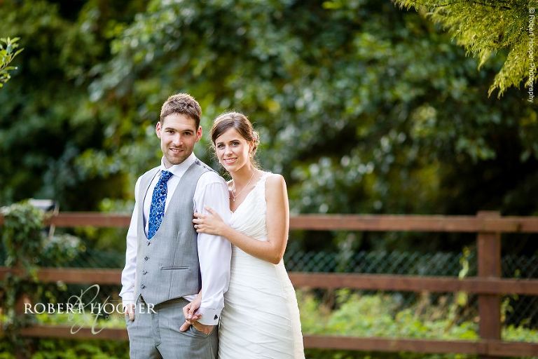 Bride and groom in beer garden for wedding photo at The Stag on the River, Eashing in Surrey