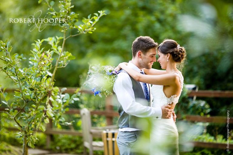 Bride and groom hug on wedding day at The Stag on the River, Eashing in Surrey