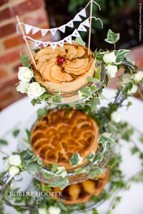 Wedding cake made up of 3 tier selection of tarts decorated with ivy for wedding day at Northbrook Park in Surrey