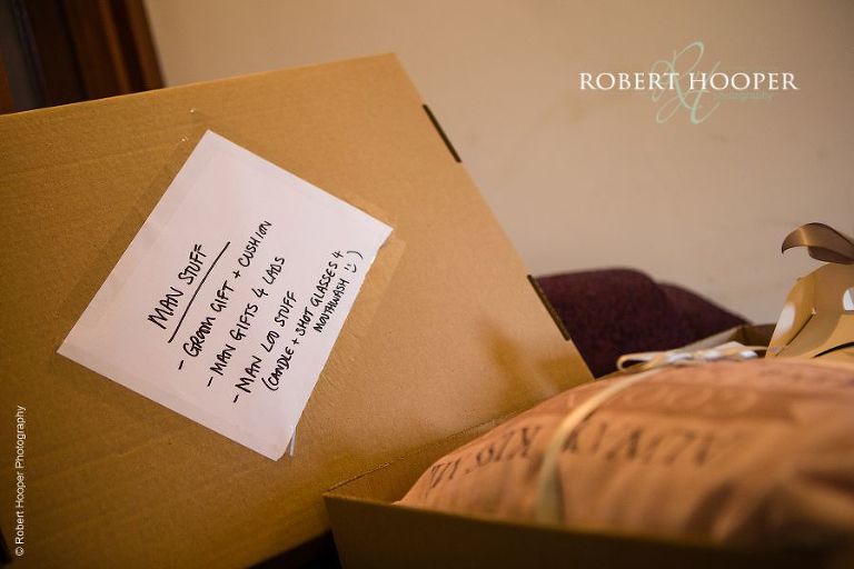 Box of "man stuff" for groom on his wedding day at Northbrook Park, Farnham in Surrey