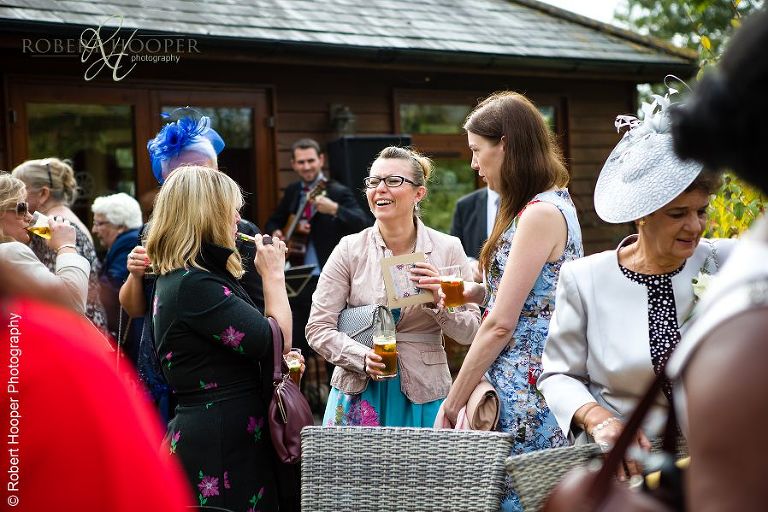 Wedding guests mingling at reception drinks
